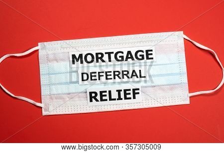 Mortgage Deferral Relief Writing On A Mask. Many Banks Worldwide Announced Mortgage And Payments Rel