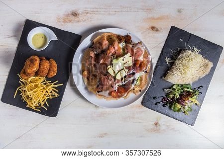 Set With Croquetes, Crepe And Mix Salad