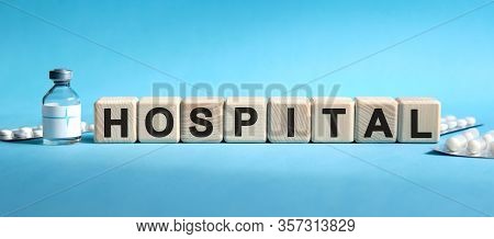 Hospital - Text On Cubes. Drug In Ambula, Tablets In Blisters To Reduce Disease Symptoms