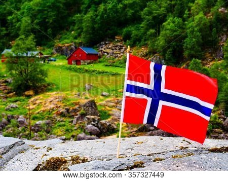 Norwegian Flag Waving Outdoor On Green Nature