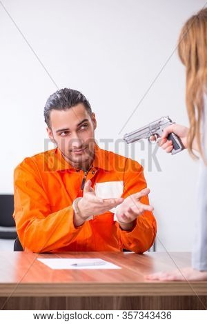 Young man meeting with advocate in pre-trial detention
