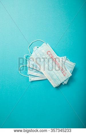 Blue Medical Disposable Face Masks With Coronavirus Printed On It.  Covid-19. Disposable Breath Filt