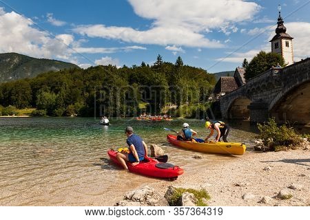 Bohinj, Slovenia - August, 03: People Kayaking In The Scenic Bohinj Lake On August 03, 2019
