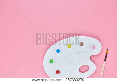 Art Of Sweetmeats Concept, Copy Space. Sweet Candy In Paint Palette On Pink Background. Love To Colo
