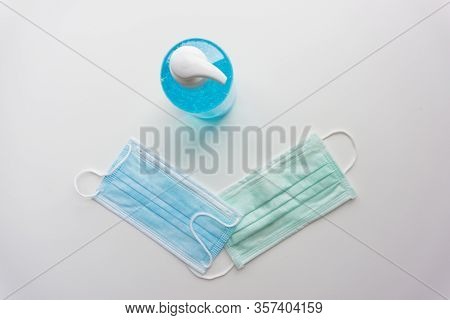 Top View Of Alcohol Gel And Mask For Protec The Spread Of Corona Virus.