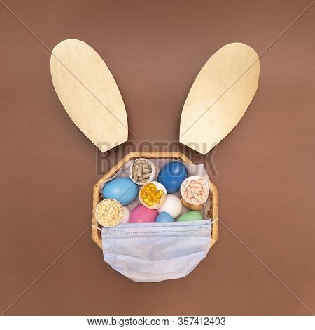 White, Blue, Green, Pink Eggs In The Wicker Basket On The Brown Background. Madical Mask On The East