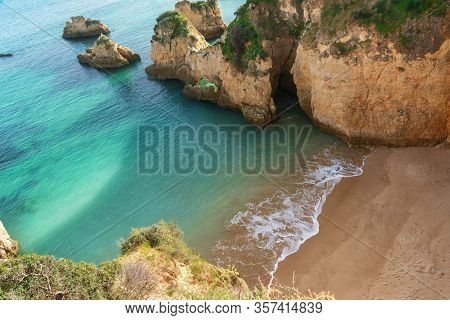 A Beautiful Bay Landscape On The Portuguese Beach Of Boiao, A Clear Blue Turquoise Sea. Algarve