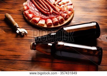 Beer Snack In The Form Of Meat Products And Bottled Beer. Appetizer In The Form Of Slicing Bacon, Sa