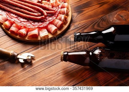 Beer Snack In The Form Of Meat Products And Bottled Beer. Appetizer In The Form Of Slicing Bacon, Sa