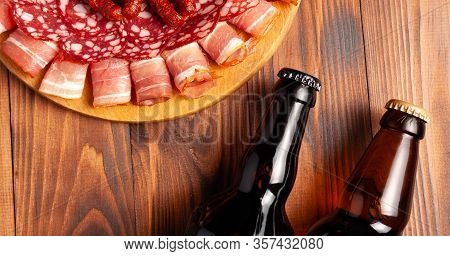 Beer Snack In The Form Of Meat Products And Bottled Beer. Appetizer In The Form Of Slicing Bacon, Sa