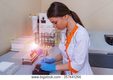 Nurse Arranges Test Tubes With Blood On A Tray. Virus Infection. Pneumonia Testing. Covid-19 And Cor