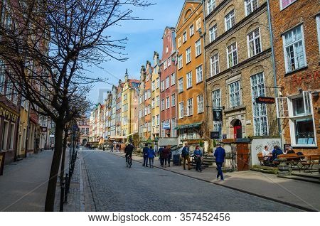 Gdansk, Poland, April 15, 2018: People Walk Along Piwna Street Pavement In Old Historical Town Centr
