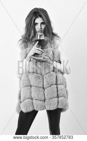 Girl Fashion Makeup Wear Fur Coat Hold Wine Glass. Lady Fashion Model Curly Hairstyle Likes Expensiv