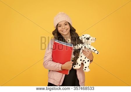 Classes Begin. Happy Small Girl Hold Toy Dog. Winter Holiday And Vacation. Childhood Happiness. Chil