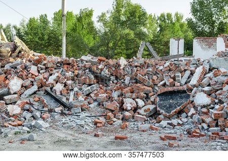 Close-up View Ruins Of Old Demolished Industrial Building. Pile Of Concrete And Brick Rubbish, Debri