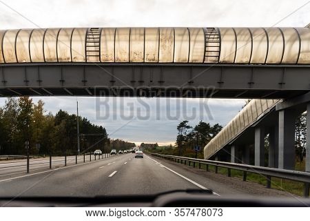 Pedestrian Crossing. Highway, Photo From The Car. High, Dirty Crossing Over The Road.