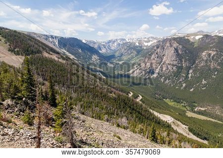 A Landscape Of Montana Mountains Still Covered In Patches Of Snow In Summer As Seen From The Beartoo