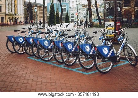 Bicycle-sharing System. Many Blue Shared Bikes On Street Parking. Bicycle Rental Service Spot On Cit