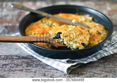 Selective Focus. Frying Pan With A Pie With Cabbage And Olives. Freshly Baked Homemade Cabbage Pie. 
