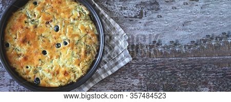 Selective Focus. Frying Pan With A Pie With Cabbage And Olives. Freshly Baked Homemade Cabbage Pie. 