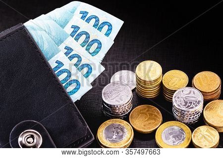 Wallet Full Of Money From Brazil, One Thousand Reais On One Hundred Reais Bank Notes. With Coins In