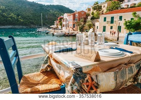Reserved Table In Greek Tavern In Assos Fishing Village, Kefalonia Island, Greece