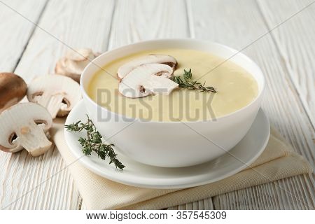 Mushroom Cream Soup On Wooden Background, Close Up