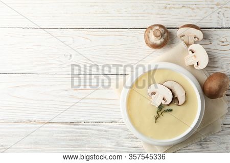 Mushroom Cream Soup On Wooden Background, Top View