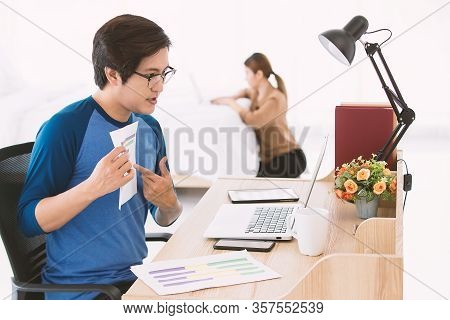 Asian Businessman Showing The Business Graph To Notebook Computer During The Office Online Meeting W