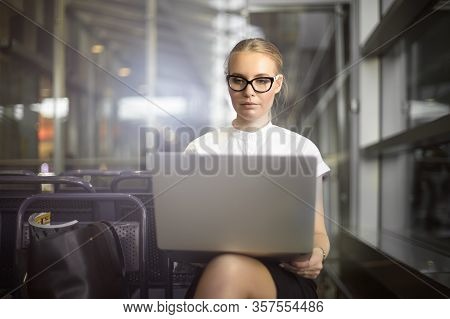 Successful Woman Entrepreneur In Glasses Checking E-mail On Portable Laptop Computer While Sitting I