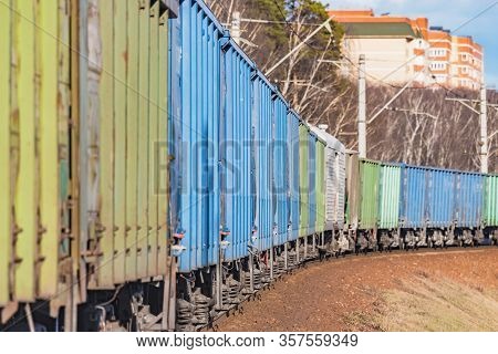 Freight Train Moves By The Spring Forest.