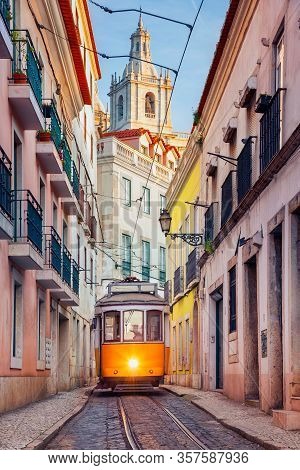 Lisbon, Portugal. Cityscape Image Of Street Of Lisbon, Portugal With Yellow Tram.