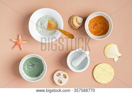 Clay Face Masks On Peach Color Background With Seashells. Spa Natural Organic Cosmetics, Summer Faci