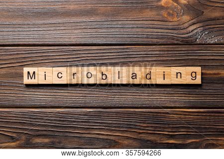 Microblading Word Written On Wood Block. Microblading Text On Wooden Table For Your Desing, Concept
