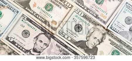 Close Up Of Different Dollar Bills As A Background. Amarican Dollars Pattern. Top View Of Business C