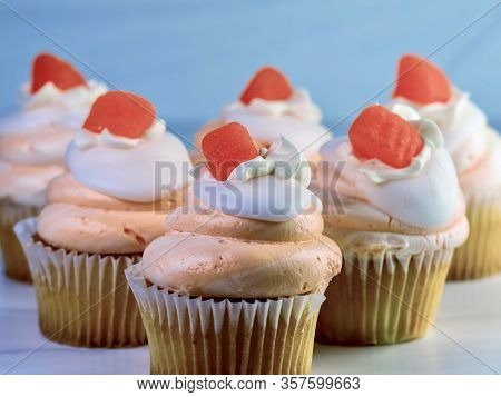 Vanilla Cupcakes With Orange And White Swirled Frosting And An Orange Candy Gumdrop On Top, Festive 