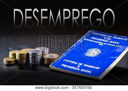 Brazilian Work Card, With The Word Unemployment Written In Portuguese In The Background. Concept Of