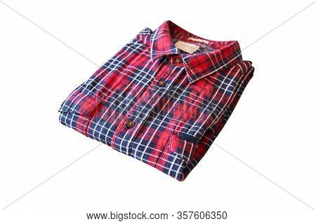 Kaliningrad, Russia - 03.20.2020: Red Checkered Flannel Shirt Folded On A White Isolated Background