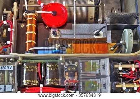 Inside View Of High Frequency Power Amplifier With Capacitors, Coils And Other Components
