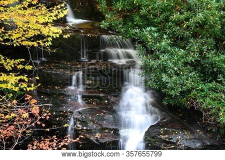 Refreshing Waterfall Hidden Deep In The Autumn Forest