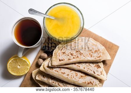 Sweet Kutabi With Honey And Tea. Chapatti With Fruits And Honey On A White.