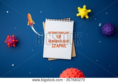 International Day Of Human Space Flight. 12 April World Cosmonautics Day. Spiral Notebook On Abstrac