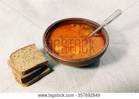 Solyanka And Rye Bread On A Linen Fabric . A Soup Of Vegetables And Meat Or Fish.