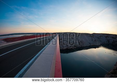 Red Bridge Over The Canyon In Croatia At Sunset. View From The Bridge To The Canyon In The Krka Nati