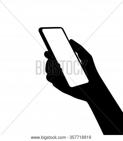A Silhouette Of A Smartphone In Person Hand. Using New Computer Technologies And Applications For Mo