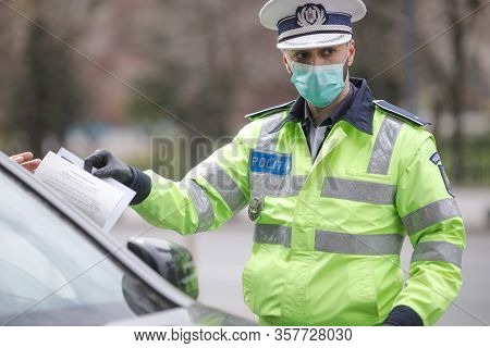 Romanian Road Police Officer Pulls Over A Car To Check For The Driver’s Identity Papers.