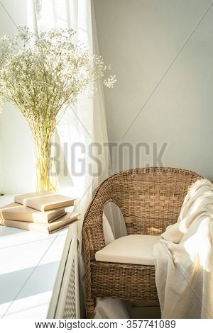 Cozy Reading Nook By The Window With Rattan Wicker Chair