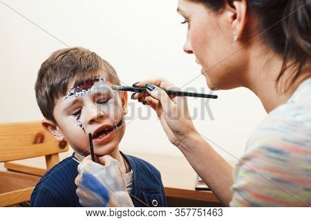 Little Cute Child Making Facepaint On Birthday Party, Zombie Apocalypse Facepainting, Halloween Prep