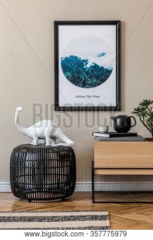 Modern Scandinavian Living Room Interior With Black Mock Up Poster Frame, Design Commode And Elegant
