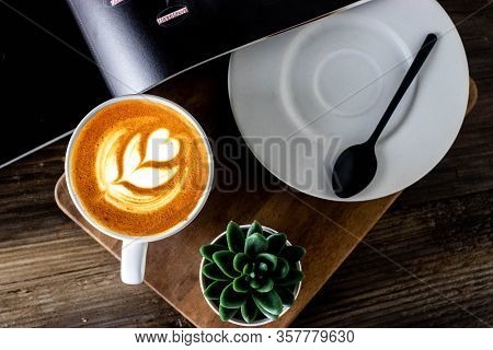 Latte Art Capuccino Widh Plate And Spoon On Wooden Table. Flat Lay Coffee